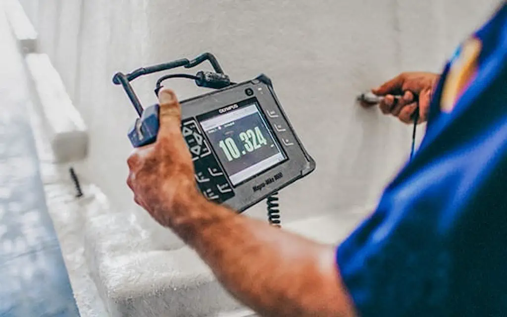Certified-Quality-Control A Leisure Pools factory worker performing quality control.