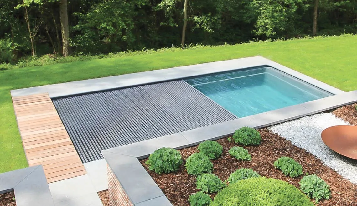 Leisure Pools Denver shows a backyard pool that makes relaxing and taking care of your yard easy.